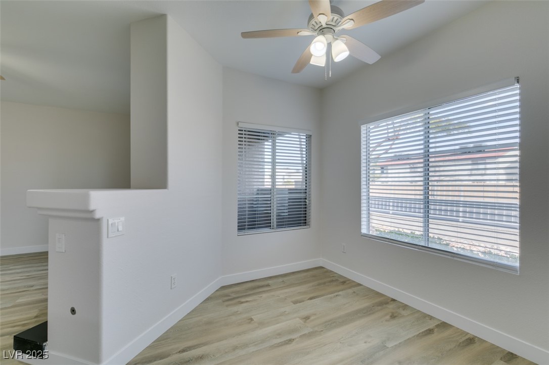 5525 West Flamingo Road, Unit 1028 Las Vegas, NV 89103 - Photo 22 of 42 Empty room with light wood-style flooring and ceiling fan