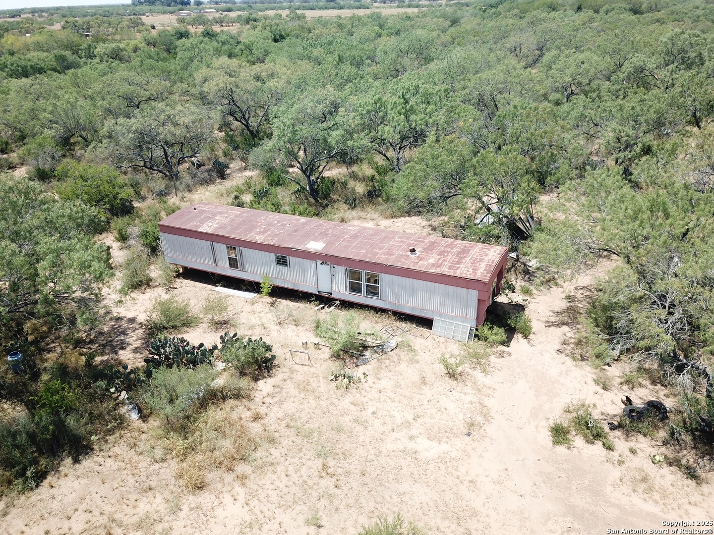 5440 Tabberer Road Poteet, TX 78065 - Photo 5 of 10 a view of a house with a yard