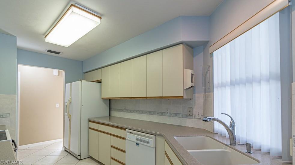1620 Forest Lakes Boulevard Naples, FL 34105 - Photo 15 of 27 a bathroom with a granite countertop sink and a bathtub