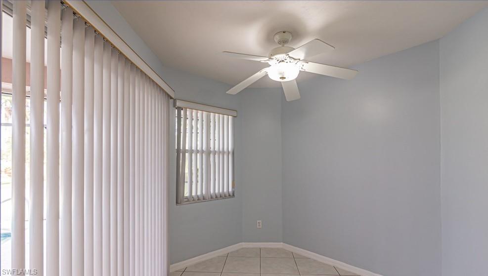 1620 Forest Lakes Boulevard Naples, FL 34105 - Photo 16 of 27 a view of a livingroom with a ceiling fan and window