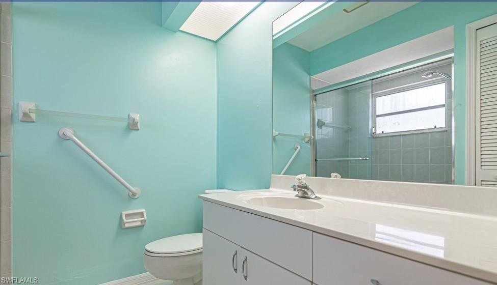 1620 Forest Lakes Boulevard Naples, FL 34105 - Photo 19 of 27 a bathroom with a sink a toilet and tub