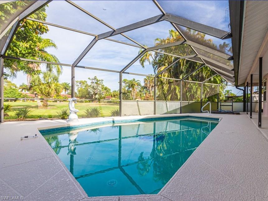 1620 Forest Lakes Boulevard Naples, FL 34105 - Photo 24 of 27 a view of swimming pool with a yard and sitting area