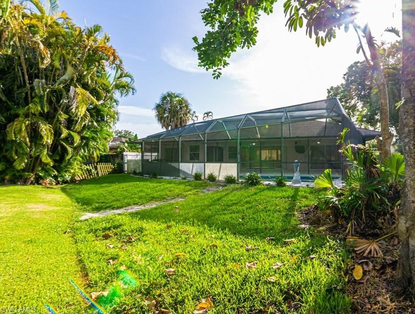 1620 Forest Lakes Boulevard Naples, FL 34105 - Photo 25 of 27 a view of a house with backyard and garden