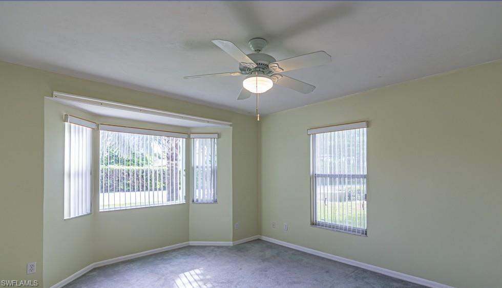1620 Forest Lakes Boulevard Naples, FL 34105 - Photo 8 of 27 a view of an empty room with a window