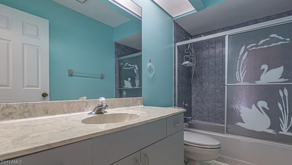 1620 Forest Lakes Boulevard Naples, FL 34105 - Photo 10 of 27 a bathroom with a granite countertop sink toilet and shower