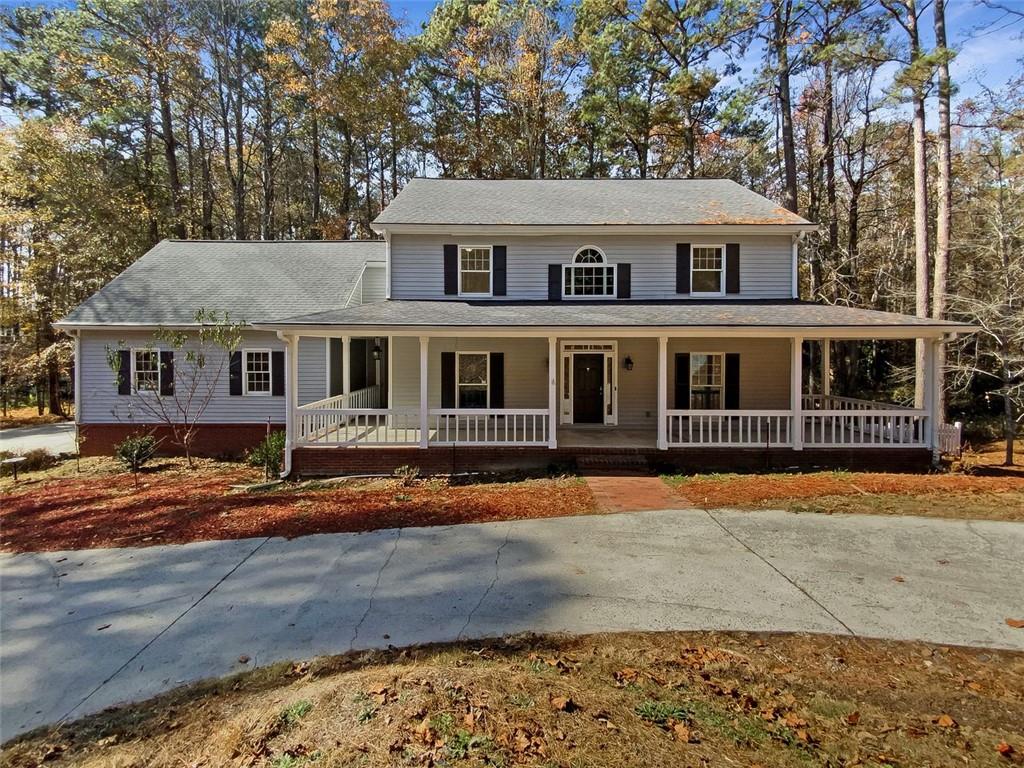 3031 Shaw Road Marietta, GA 30066 - Photo 1 of 1 a front view of a house with a yard