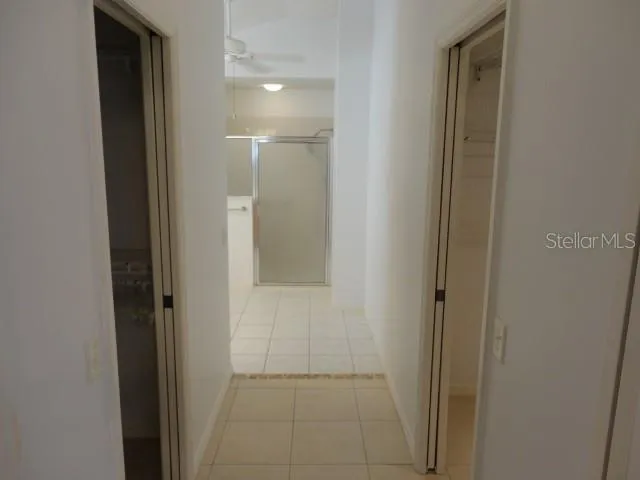 a spacious bathroom with a granite countertop sink a mirror and a