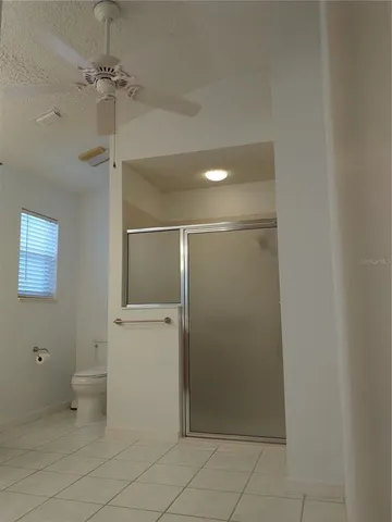 a bathroom with a glass shower door