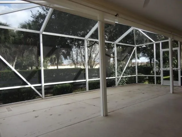 a view of outdoor space with wooden floor and fence