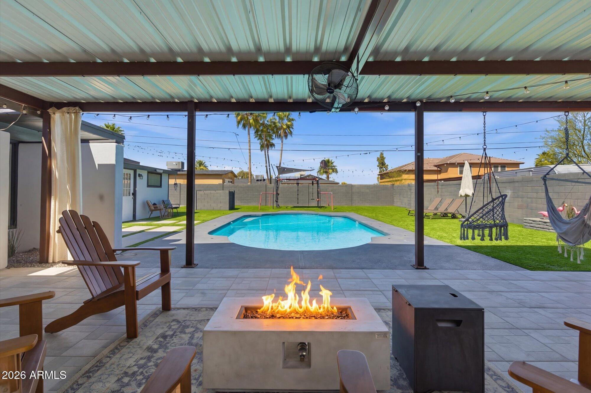 3020 East Wethersfield Road Phoenix, AZ 85032 - Photo 1 of 46 a view of a swimming pool with a patio