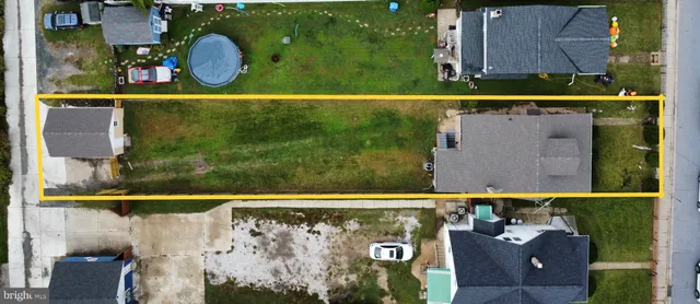 a aerial view of a house with swimming pool garden and patio