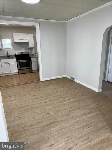 a kitchen with stainless steel appliances a refrigerator and stove