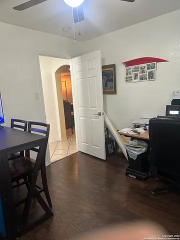 a workspace with furniture and wooden floor