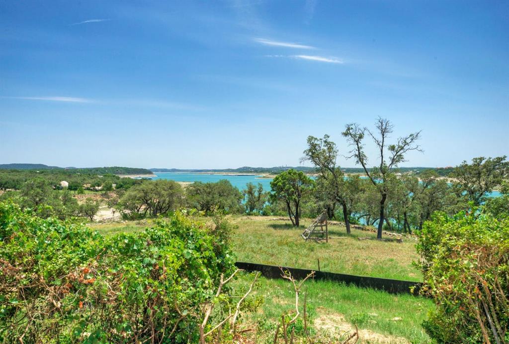 8005 Sharon Road Leander, TX 78641 - Photo 7 of 12 a view of a lake with a yard