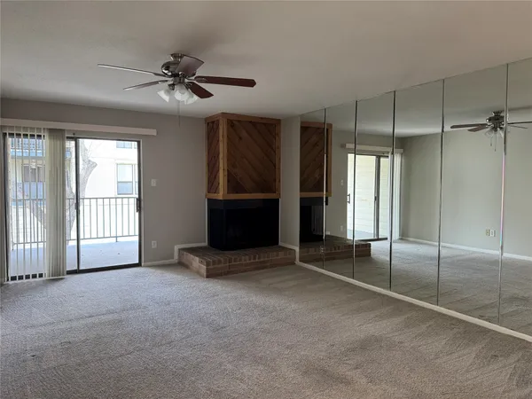 a room with window and a fireplace