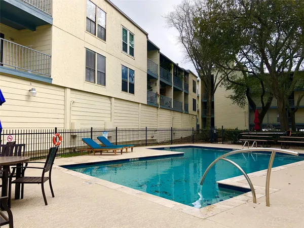 a view of outdoor space yard swimming pool and sitting area