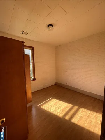 an empty room with a empty space and window