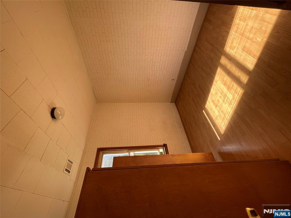 71 Passaic Street, Unit 2 Passaic, NJ 07055 - Photo 8 of 11 an empty room with a empty space and window