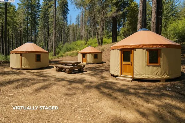 a backyard of a house with yard barbeque oven and outdoor seating