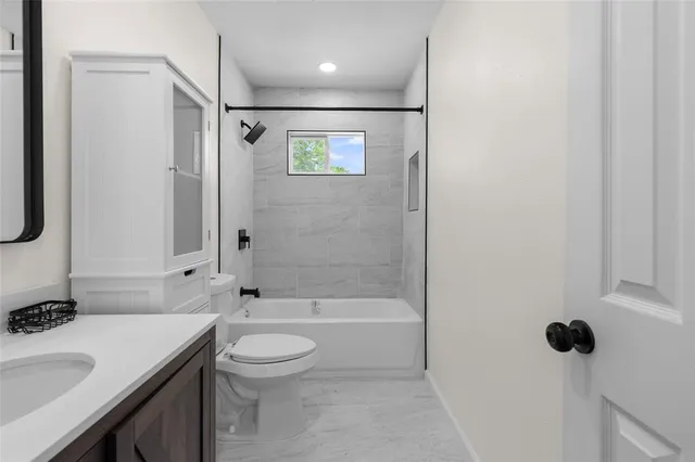 a bathroom with a sink toilet a shower and a mirror