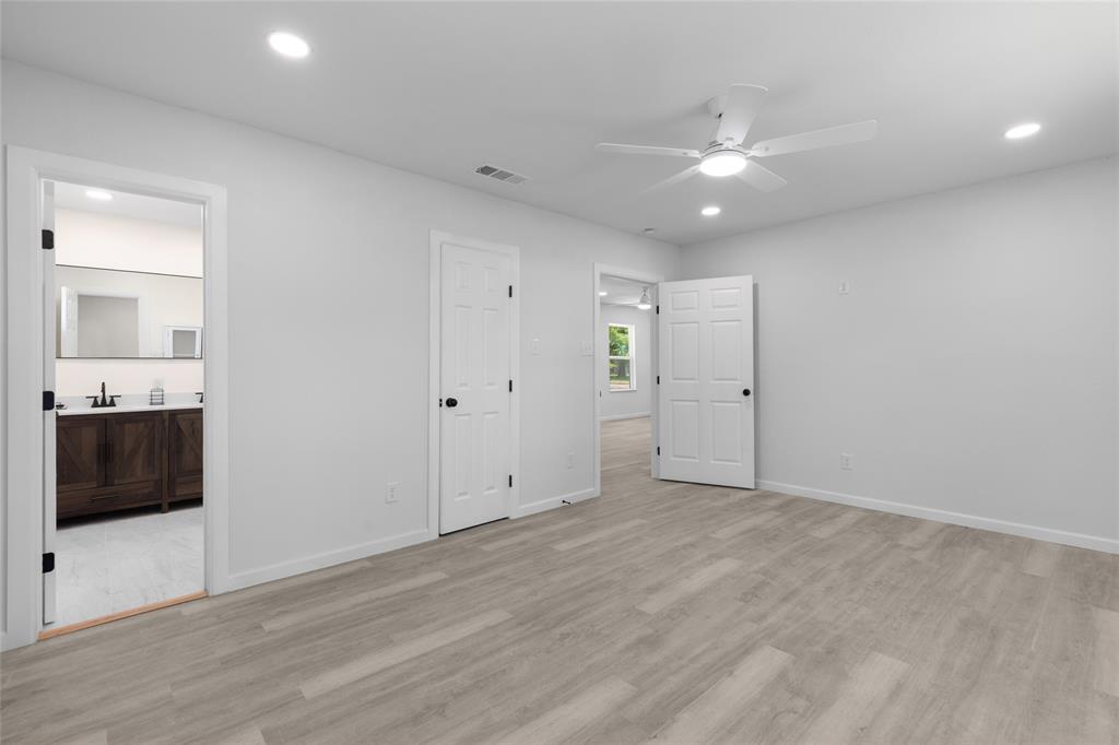 211 Southeast 7th Street Cooper, TX 75432 - Photo 20 of 29 an empty room with a bathroom and a sink