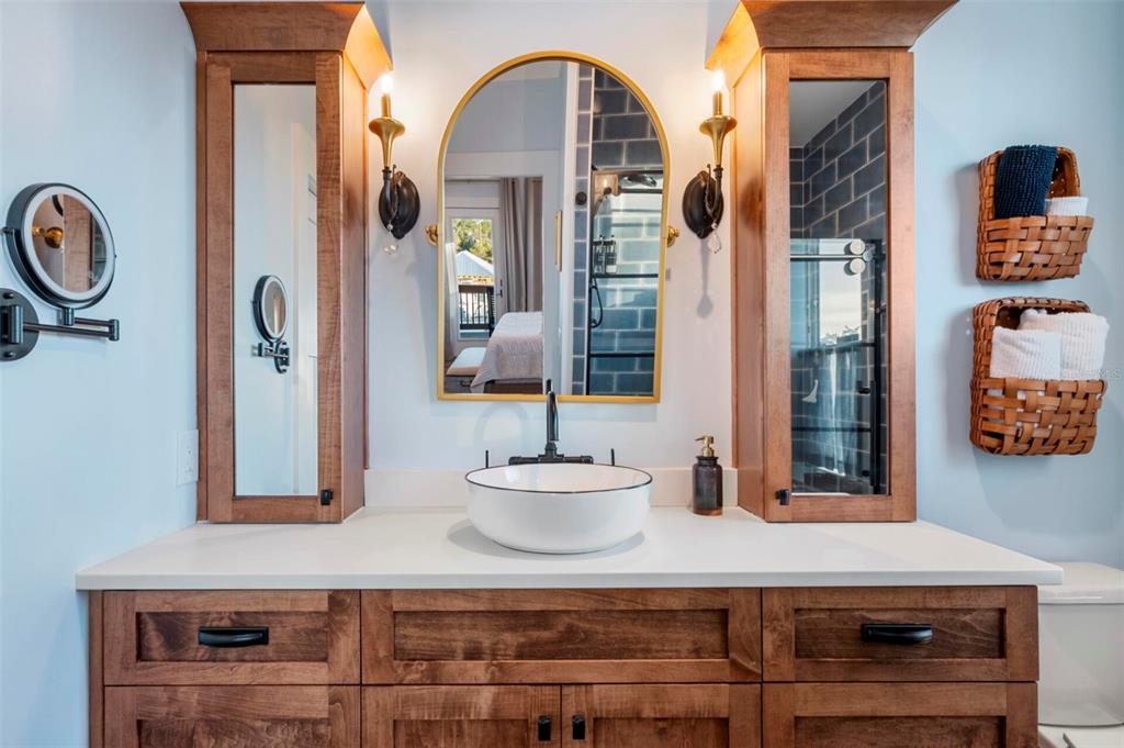 331 Land Street Eastpoint, FL 32328 - Photo 16 of 36 a bathroom with a sink and a mirror