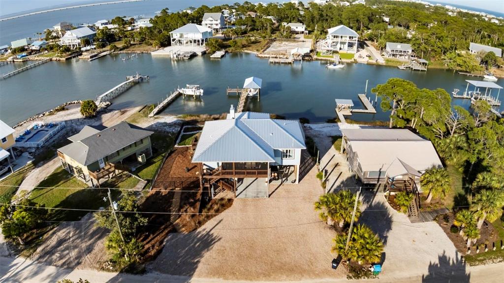 331 Land Street Eastpoint, FL 32328 - Photo 2 of 36 an aerial view of a house with a lake view