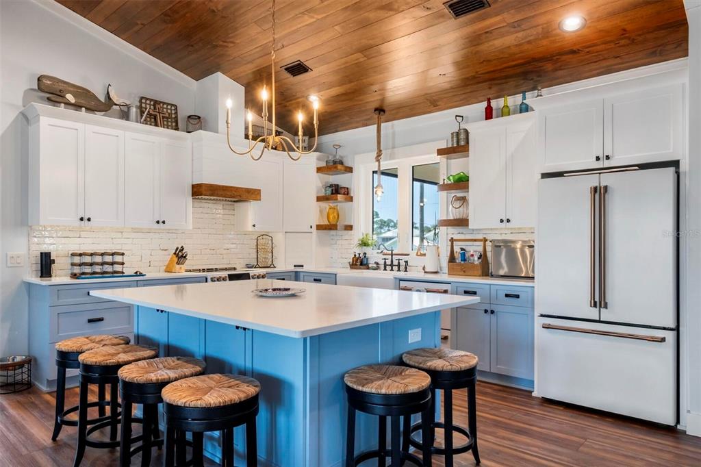 331 Land Street Eastpoint, FL 32328 - Photo 25 of 36 a kitchen with stainless steel appliances a sink and a refrigerator