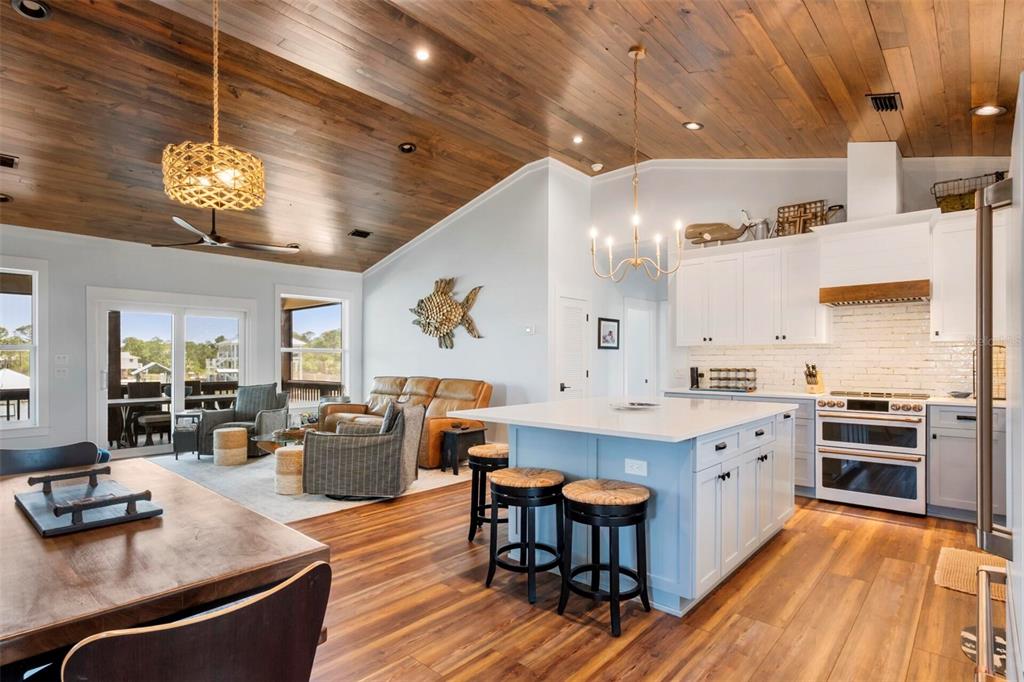331 Land Street Eastpoint, FL 32328 - Photo 27 of 36 a large kitchen with a table and chairs