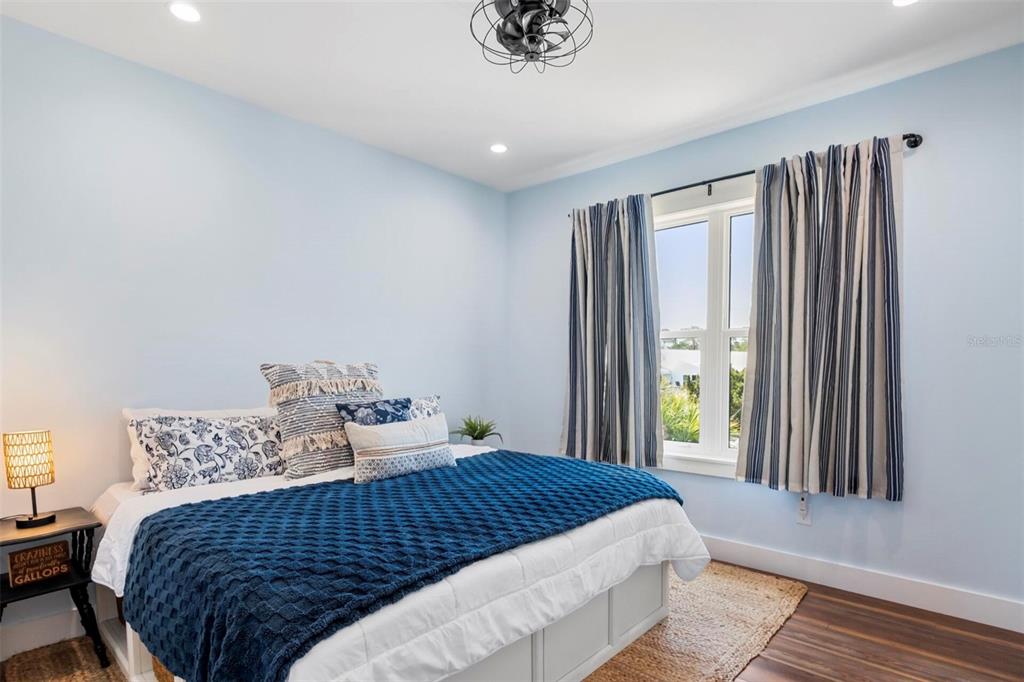 331 Land Street Eastpoint, FL 32328 - Photo 28 of 36 a bedroom with a bed and a window