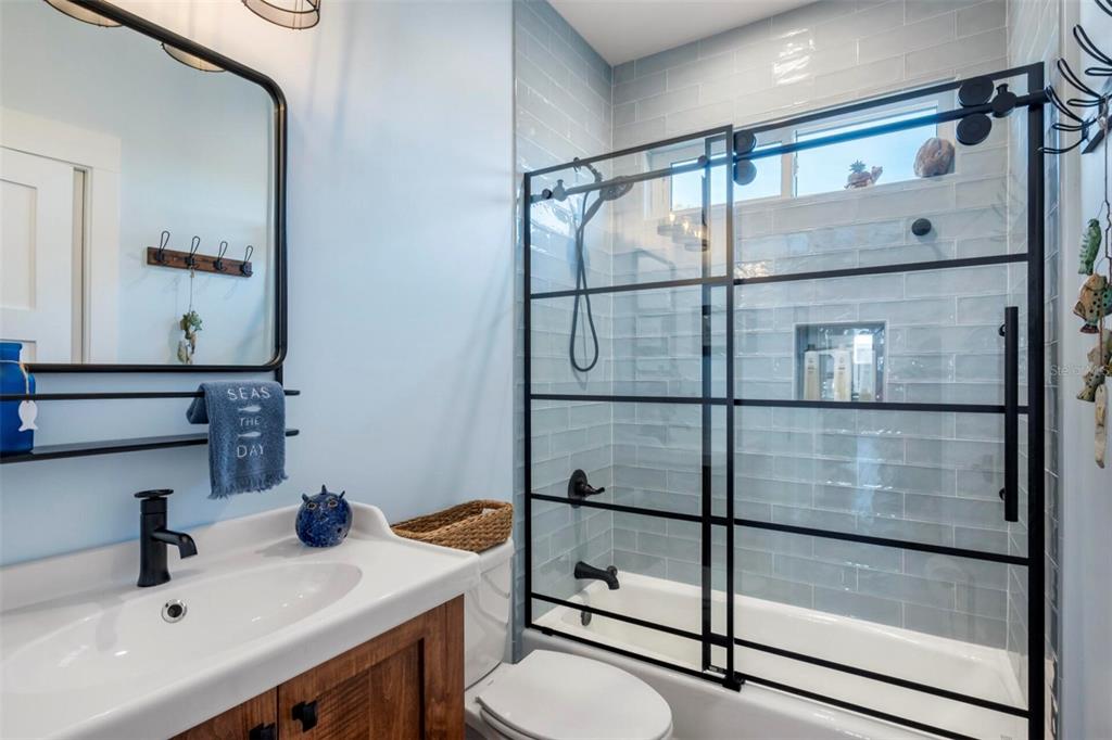 331 Land Street Eastpoint, FL 32328 - Photo 29 of 36 a bathroom with a sink and mirror