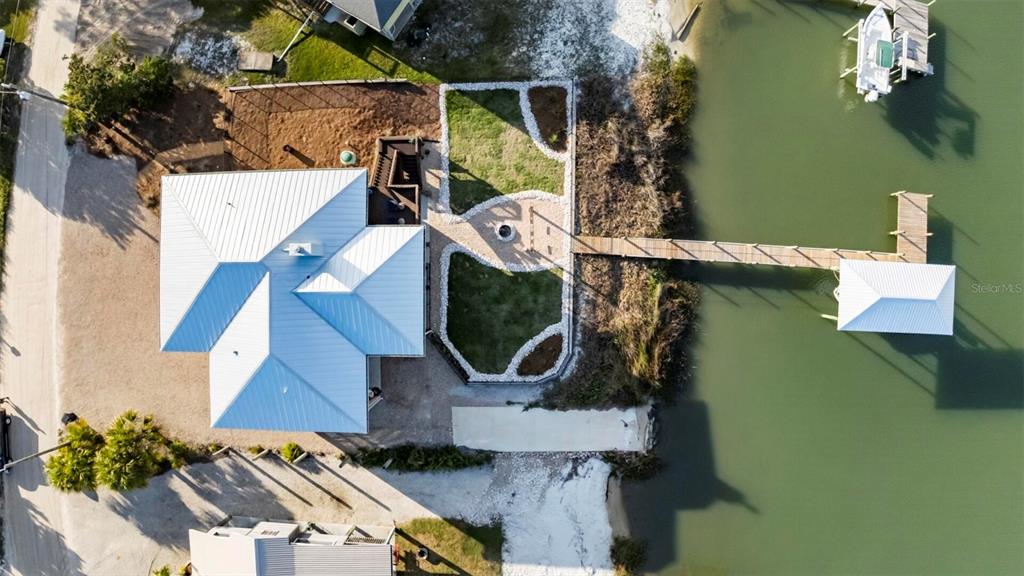 331 Land Street Eastpoint, FL 32328 - Photo 4 of 36 an aerial view of a house with a yard