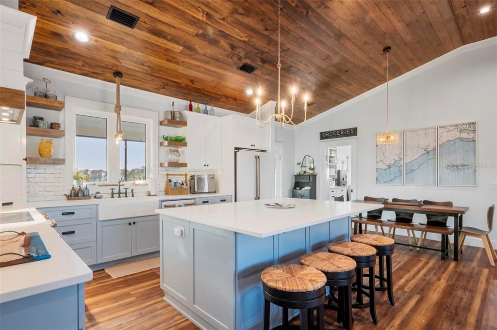 331 Land Street Eastpoint, FL 32328 - Photo 8 of 36 a large kitchen with a table and chairs