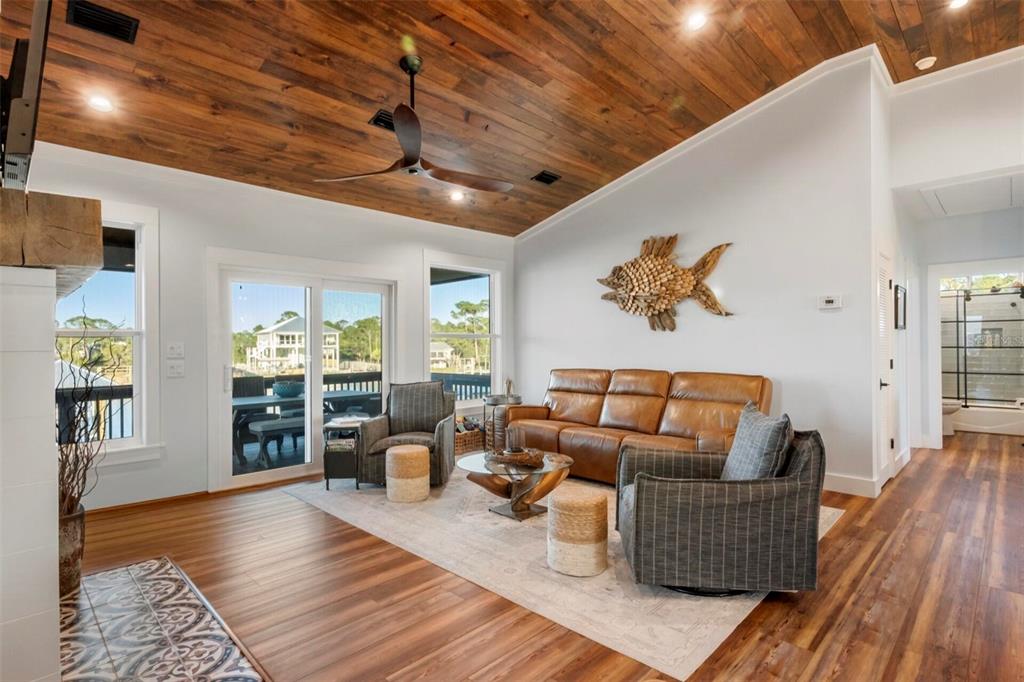 331 Land Street Eastpoint, FL 32328 - Photo 10 of 36 a living room with furniture and wooden floor