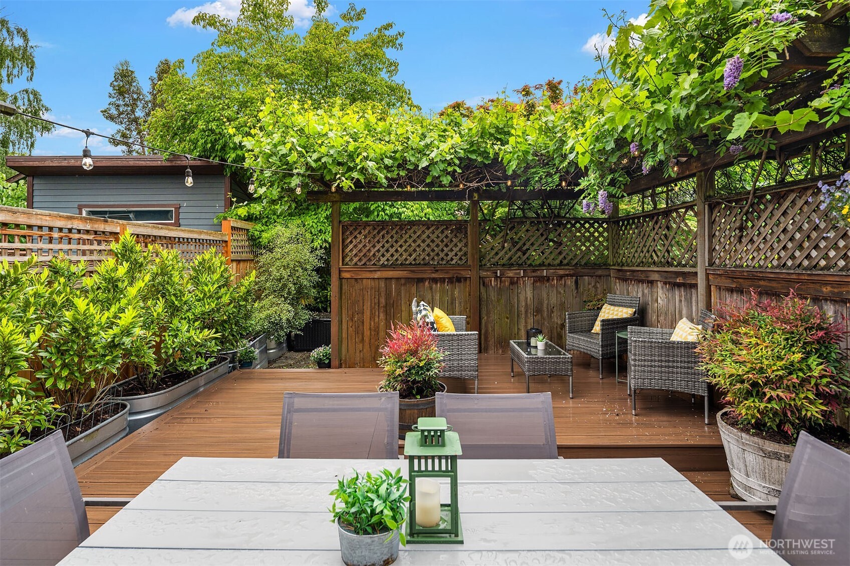 519 27th Avenue Seattle, WA 98122 - Photo 30 of 38 a view of a patio with couches table and chairs and potted plants