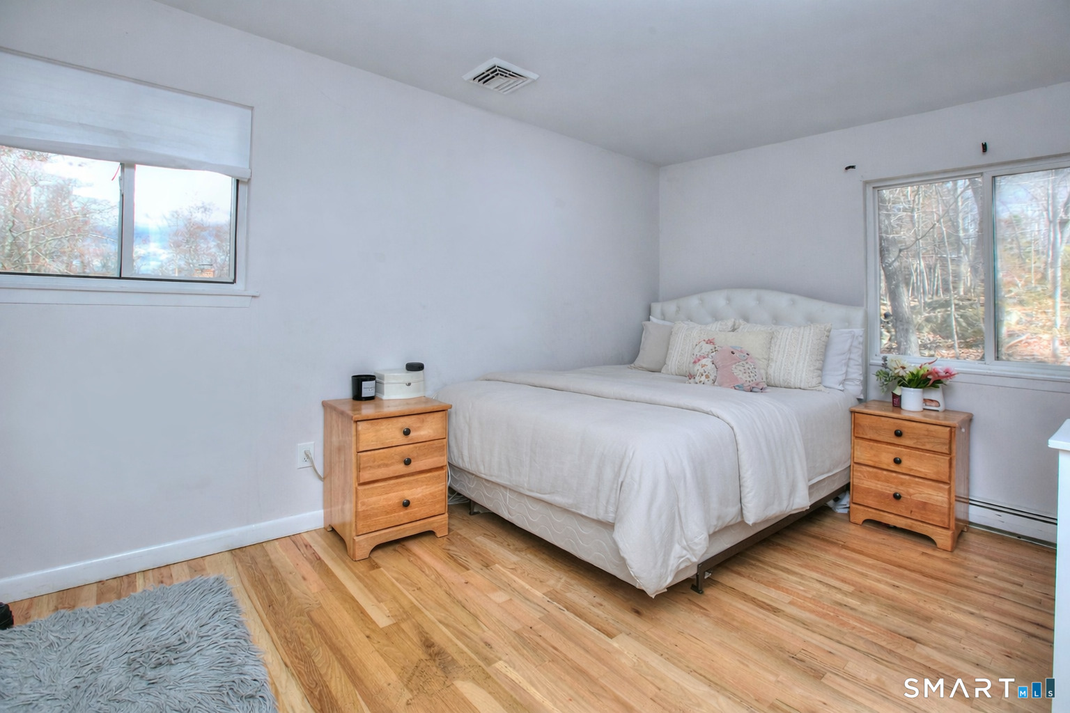 518 Bennetts Farm Road Ridgefield, CT 06877 - Photo 12 of 32 a bedroom with a bed and a dresser next to a window