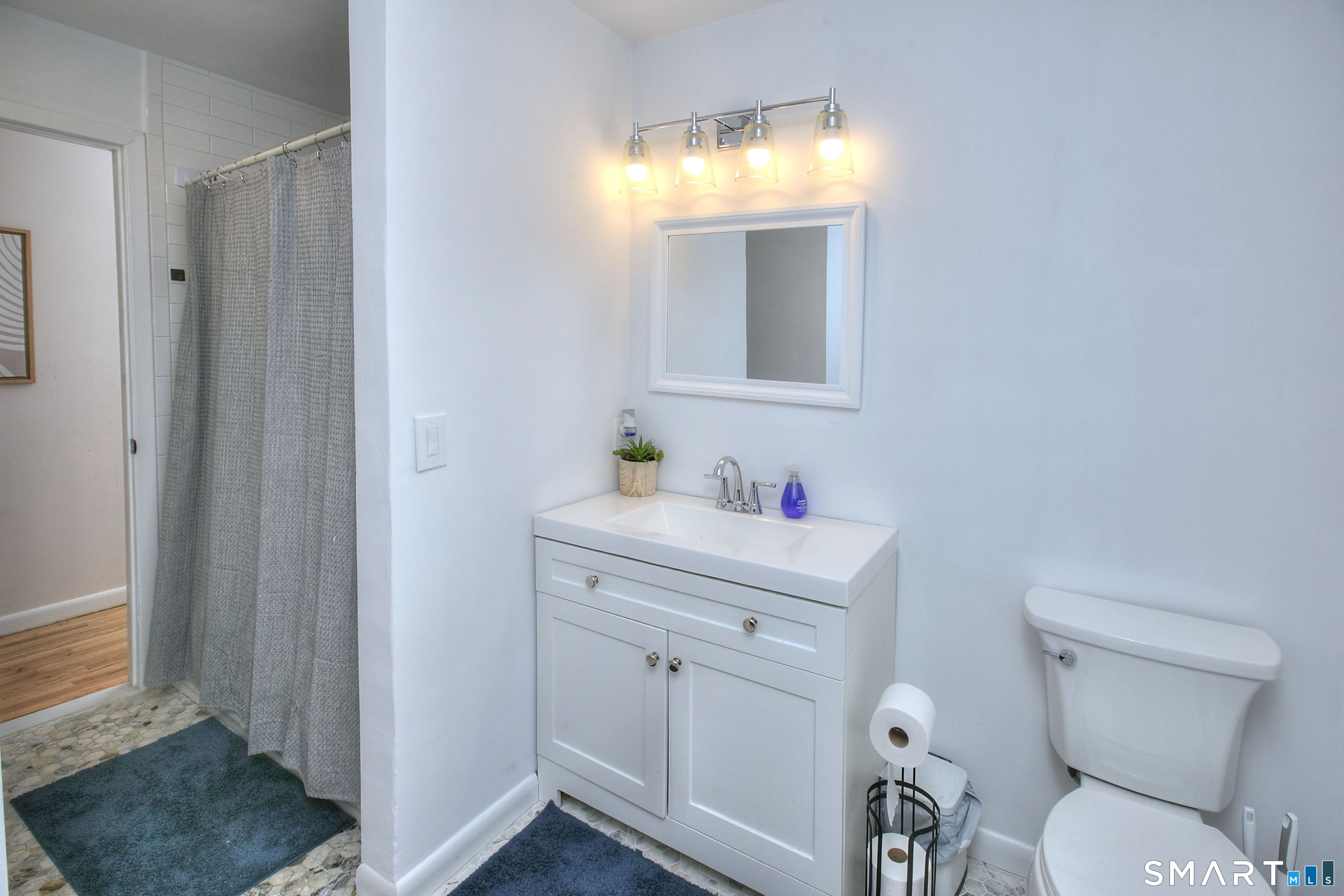 518 Bennetts Farm Road Ridgefield, CT 06877 - Photo 15 of 32 a bathroom with a sink vanity and a toilet