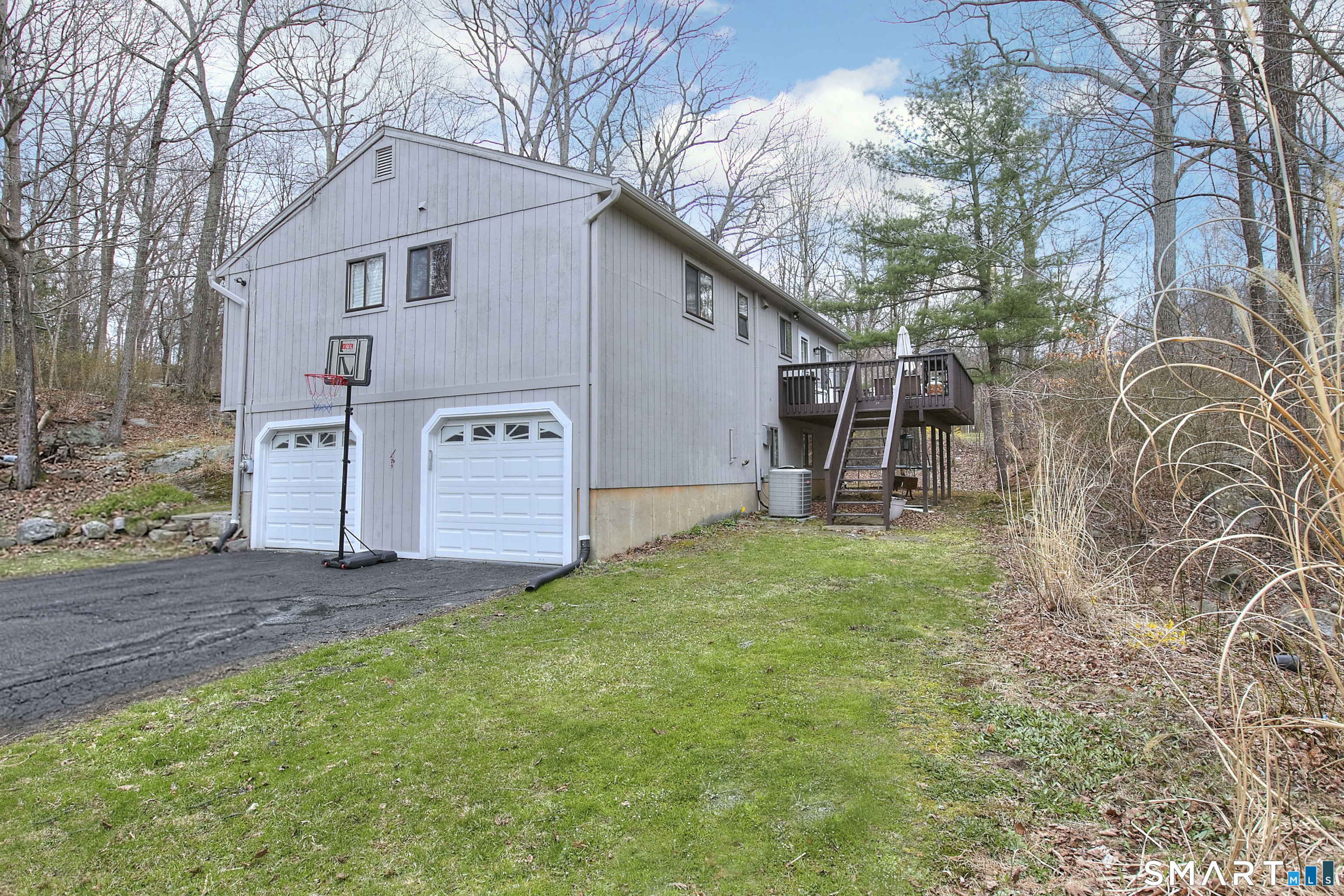 518 Bennetts Farm Road Ridgefield, CT 06877 - Photo 19 of 32 a view of a house with a yard and garage