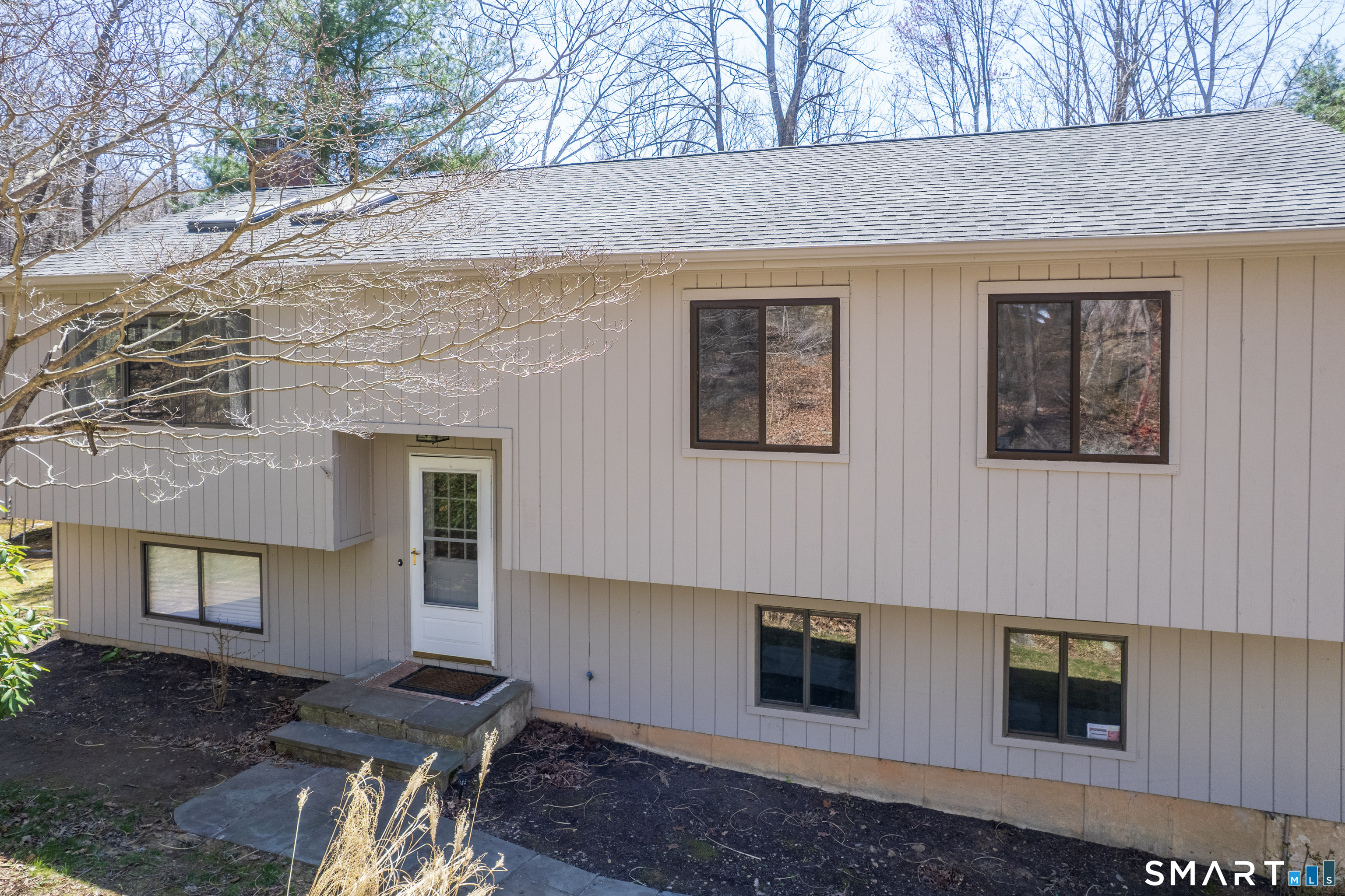 518 Bennetts Farm Road Ridgefield, CT 06877 - Photo 2 of 32 a front view of a house with a yard