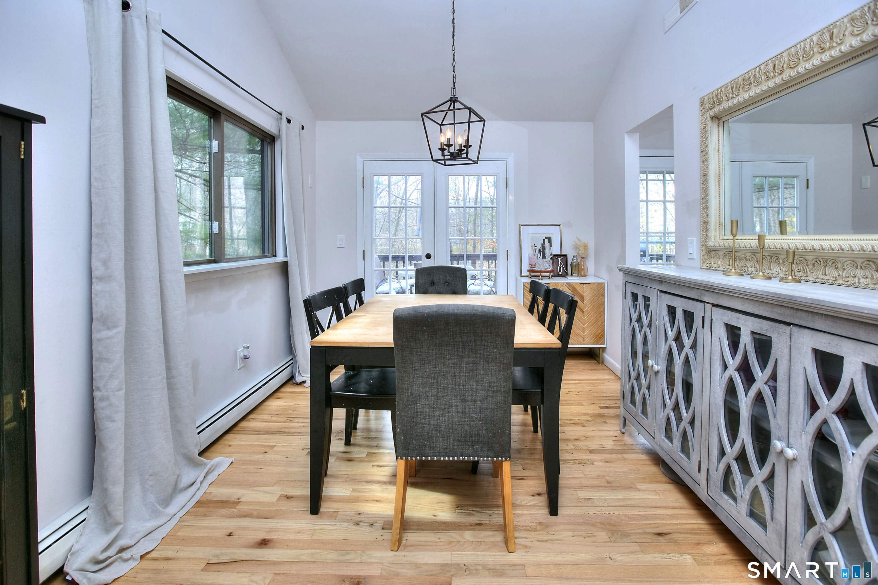 518 Bennetts Farm Road Ridgefield, CT 06877 - Photo 7 of 32 a view of a dining room with furniture window and wooden floor