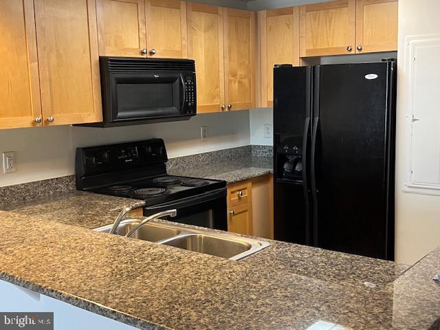 777 7th Street Northwest, Unit 930 Washington, DC 20001 - Photo 11 of 34 a kitchen with a stove microwave and refrigerator