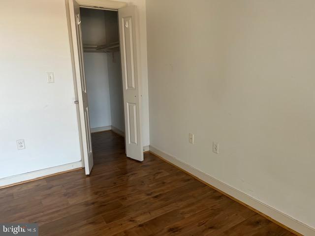 777 7th Street Northwest, Unit 930 Washington, DC 20001 - Photo 18 of 34 a view of an empty room with wooden floor and closet
