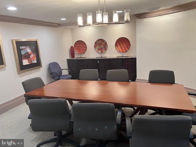 777 7th Street Northwest, Unit 930 Washington, DC 20001 - Photo 19 of 34 a view of a dining room with furniture and chandelier