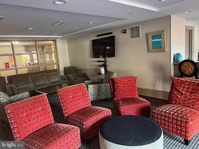 777 7th Street Northwest, Unit 930 Washington, DC 20001 - Photo 22 of 34 a living room with furniture and a flat screen tv