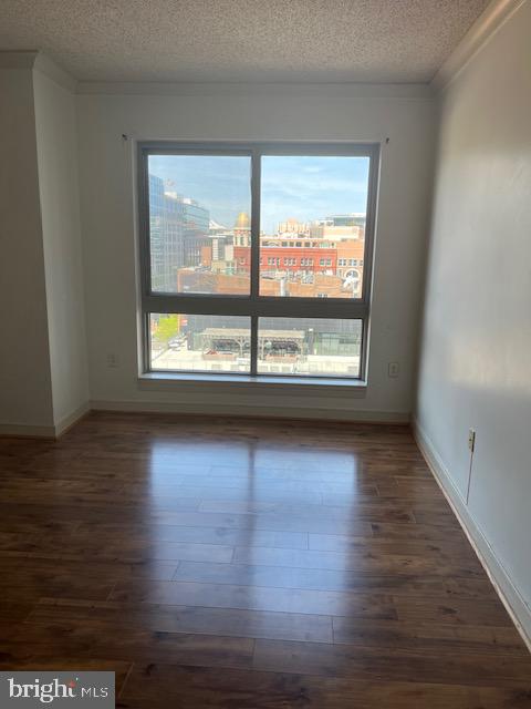 777 7th Street Northwest, Unit 930 Washington, DC 20001 - Photo 6 of 34 wooden floor in an empty room with a window
