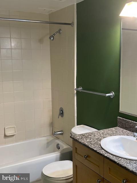 777 7th Street Northwest, Unit 930 Washington, DC 20001 - Photo 7 of 34 a bathroom with a granite countertop toilet sink and mirror