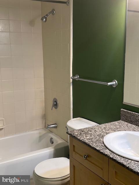 777 7th Street Northwest, Unit 930 Washington, DC 20001 - Photo 8 of 34 a bathroom with a granite countertop toilet sink and mirror