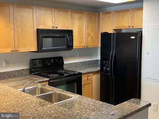 777 7th Street Northwest, Unit 930 Washington, DC 20001 - Photo 10 of 34 a kitchen with a sink stove and refrigerator