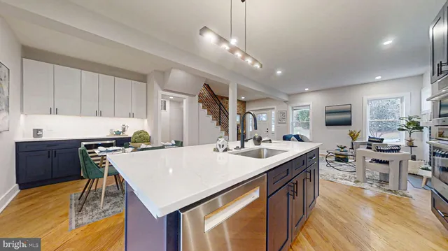 a bathroom with a sink toilet vanity and tub