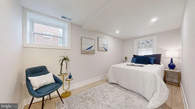 a bed room with a bed and a table